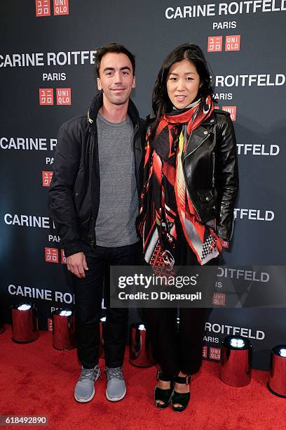 Laura Kim and guest attend the UNIQLO Fall/Winter 2016 Carine Roitfeld Collection Launch at UNIQLO on October 26, 2016 in New York City.