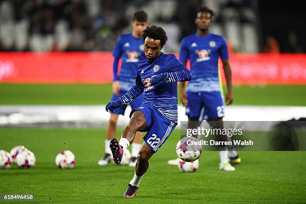 Willian of Chelsea warms up ahead of the EFL Cup fourth round match between West Ham United and Chelsea at The London Stadium on October 26, 2016 in...