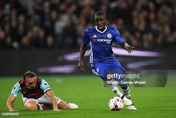 Golo Kante of Chelsea goes past Mark Noble of West Ham United during the EFL Cup fourth round match between West Ham United and Chelsea at The London...