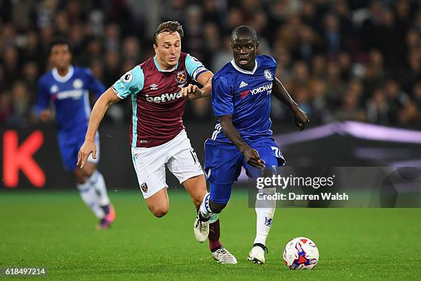 Golo Kante of Chelsea goes past Mark Noble of West Ham United during the EFL Cup fourth round match between West Ham United and Chelsea at The London...