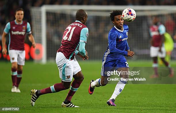 Willian of Chelsea and Angelo Ogbonna of West Ham United during the EFL Cup fourth round match between West Ham United and Chelsea at The London...