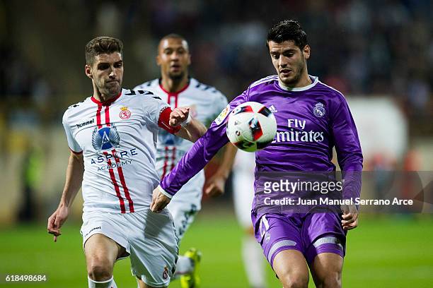 Alvaro Morata of Real Madrid duels for the ball with Ivan Gonzalez of Cultural Leonesa during the Copa del Rey Round of 32 match between Cultural...