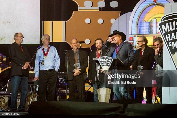 Garth Brooks inducts his G-Men into the Muscians Hall of Fame at Nashville Municipal Auditorium on October 26, 2016 in Nashville, Tennessee.