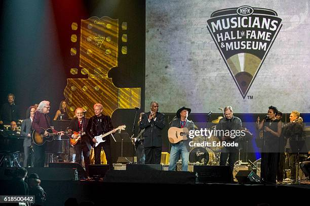Ricky Skaggs, Don Felder, Russell Thompkins Jr., Garth Brooks, Steve Wariner, Melinda Doolittle play the finale at the Nashville Municipal Auditorium...