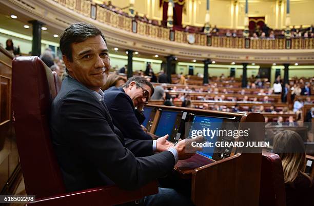 Former leader of the Spanish Socialist Party , Pedro Sanchez and former president of the parliament, Socialist Patxi Lopez , sit on their seats after...