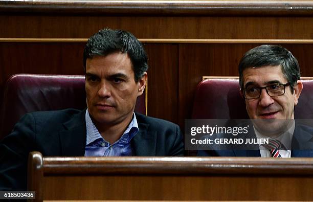 Former leader of the Spanish Socialist Party , Pedro Sanchez and former president of the parliament, Socialist Patxi Lopez , sit on their seats at...