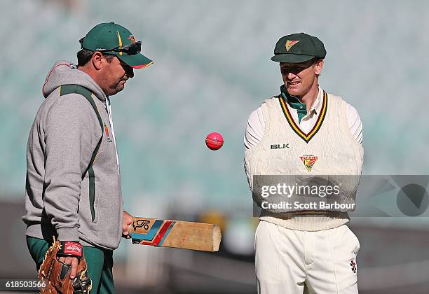 Dan Marsh, coach of Tasmania and George Bailey talk during day three of the Sheffield Shield match between Victoria and Tasmania at the Melbourne...