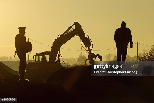 Heavy machinery moves into the Calais 'Jungle' migrant camp to demolish the site on October 27, 2016 in Calais, France. Authorities have now declared...