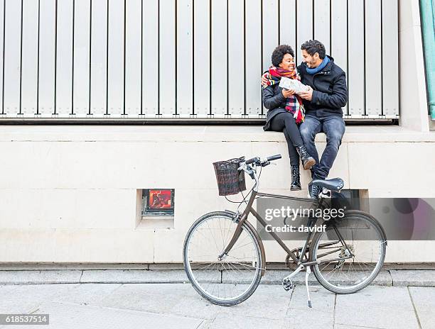 romantic hipster couple giving christmas gifts - daily life during christmas season in dublin stock pictures, royalty-free photos & images