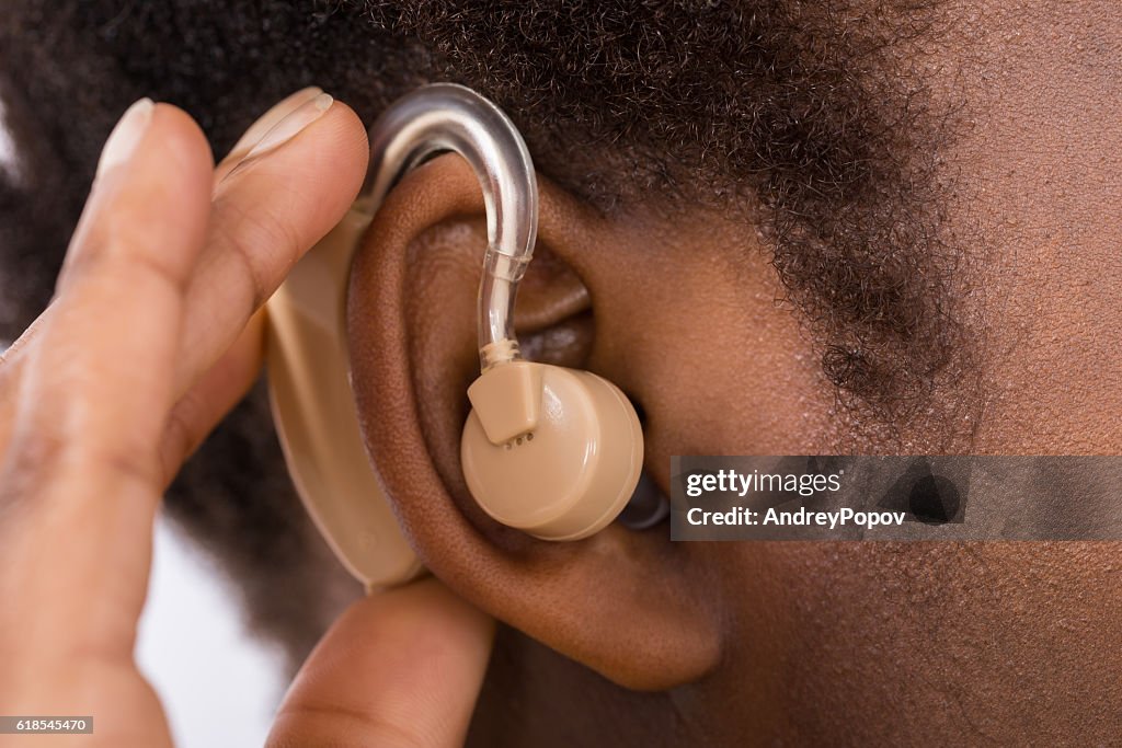 Woman Wearing Hearing Aid In Ear