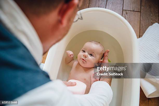 baby bathtime - taking a bath stock pictures, royalty-free photos & images