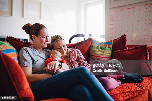 mothers, daughter and dog time - casal gay imagens e fotografias de stock