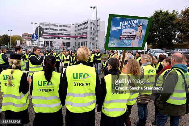 Striking flight crews from airliners Eurowings and Germanwings gather during a one-day strike outside the Eurowings and Germanwings corporate...