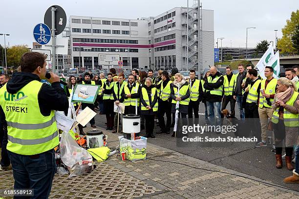 Striking flight crews from airliners Eurowings and Germanwings gather during a one-day strike outside the Eurowings and Germanwings corporate...
