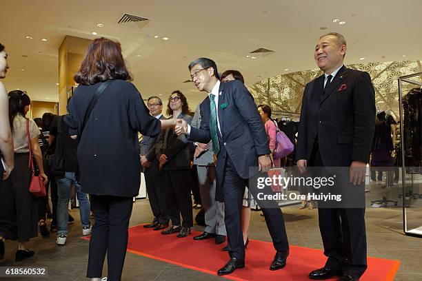 Hiroshi Ohnishi, President and CEO of Isetan Mitsukoshi Holdings Ltd. Greets and shoppers storm in as ISETAN The Japan Store opens on October 27,...