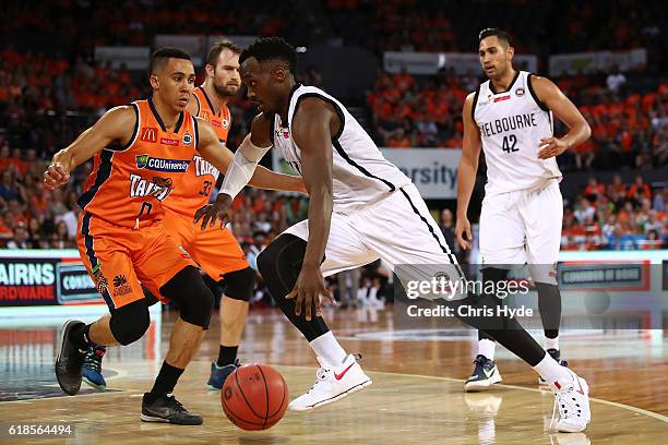 Cedric Jackson of United drives to the basket during the round four NBL match between the Cairns Taipans and Melbourne United at Cairns Convention...