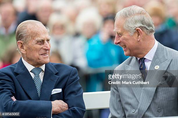 Prince Philip, Duke of Edinburgh and Prince Charles, Prince of Wales attend the unveiling of a statue of Queen Elizabeth The Queen Mother during a...