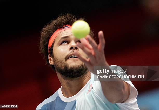 France's Jo-Wilfried Tsonga serves the ball to German's Philipp Kohlschreiber during their match of the Erste Bank Open ATP tennis tournament in...