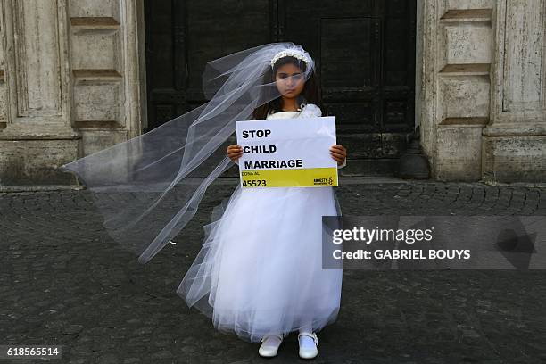 Young actress plays the role of Giorgia forced to marry Paolo during a happening organised by Amnesty International to denounce child marriage, on...