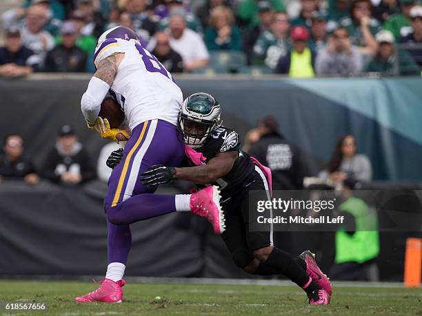 Jaylen Watkins of the Philadelphia Eagles tackles Kyle Rudolph of the Minnesota Vikings at Lincoln Financial Field on October 23, 2016 in...