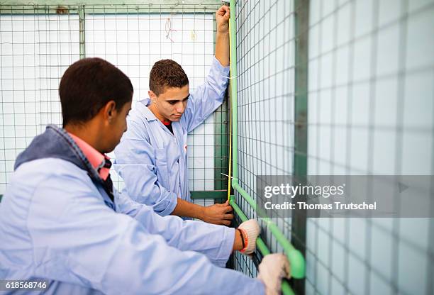 Al Rusaifeh, Jordan Two apprentices from the domain of sanitary installations are laying pipes in the vocational training center VTC on October 05,...
