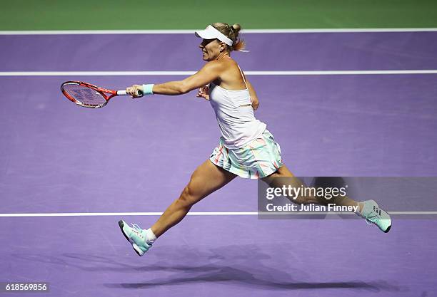 Angelique Kerber of Germany plays a forehand in her singles match against Madison Keys of the United States during day 5 of the BNP Paribas WTA...