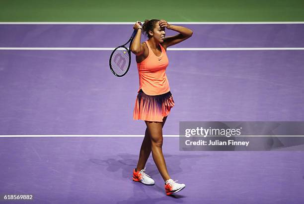 Madison Keys of the United States reacts in her singles match against Angelique Kerber of Germany during day 5 of the BNP Paribas WTA Finals...