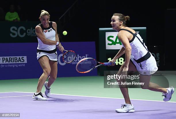 Timea Babos of Hungary and Yaroslava Shvedova of Kazakhstan in action in their doubles match against Bethanie Mattek-Sands of the United States and...