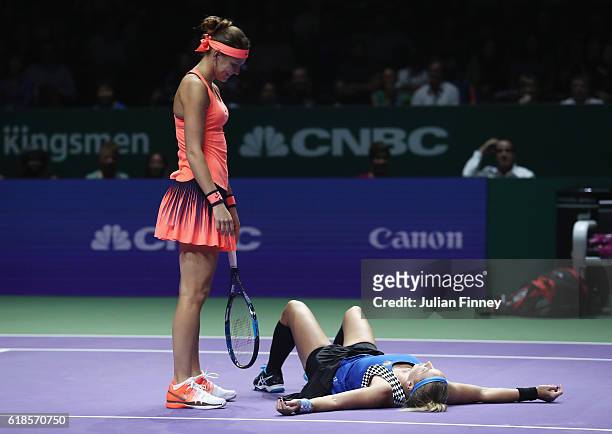 Bethanie Mattek-Sands of the United States goes to ground partnering Lucie Safarova of Czech Republic in their doubles match against Yaroslava...