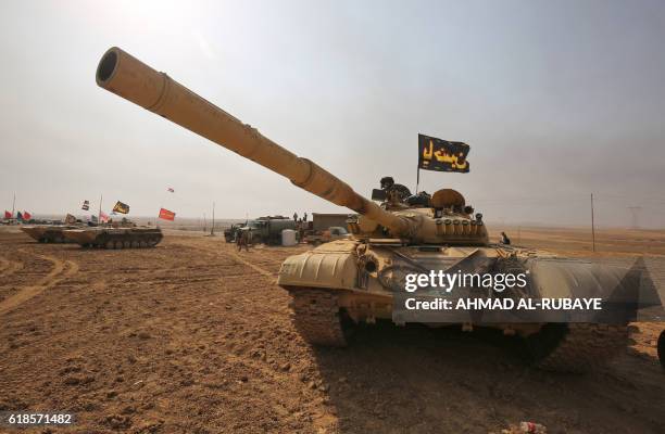 An Iraqi forces T-72 tank is stationed near the village of Sin al-Dhuban, south of Mosul, on October 27 during an operation to retake the main hub...