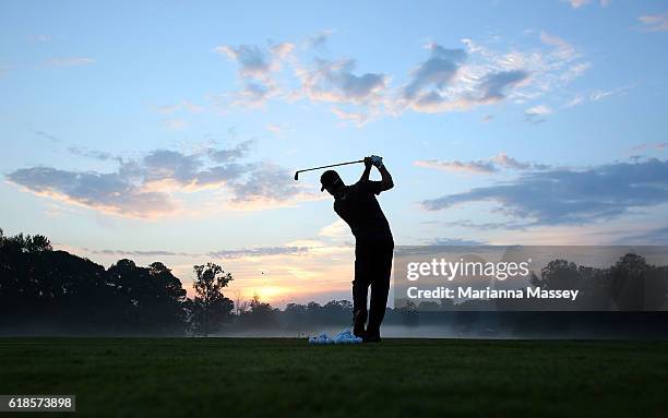 Eric Axley practices on the range prior to teeing off during the First Round of the Sanderson Farms Championship at the Country Club of Jackson on...
