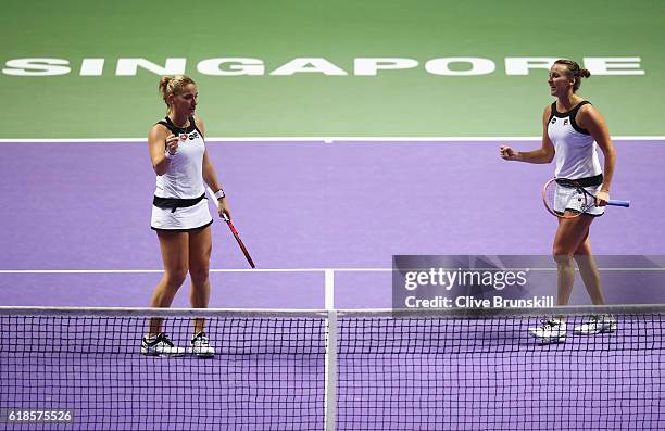 Yaroslava Shvedova of Kazakhstan and Timea Babos of Hungary celebrate in their doubles match against Bethanie Mattek-Sands of the United States and...