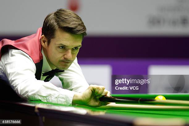 Michael Holt of England plays a shot during the quarter-final match against Stuart Bingham of England on Day five of the International Championship...