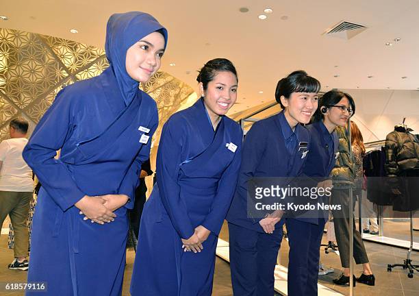 Sales staff at a newly launched Isetan Mitsukoshi Holdings Ltd. Store in Kuala Lumpur bow to customers to welcome them on Oct. 27, 2016. The outlet...
