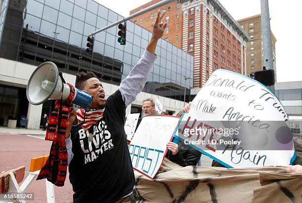 Local activist Julian Mack leads a protest against Republican presidential nominee Donald Trump outside the SeaGate Convention Centre on October 27,...