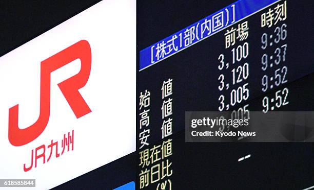 An electric board in Tokyo shows Kyushu Railway Co. Shares opening at 3,100 yen on Oct. 25 when the southwestern Japan railway debuted on the First...