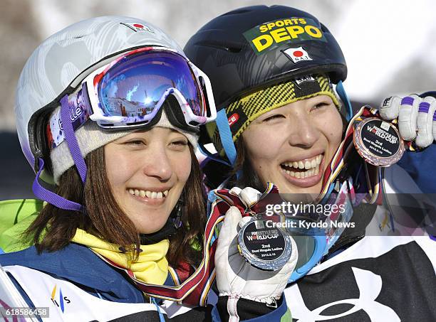 Yuzawa, Japan - Japan's Aiko Uemura and teammate Miki Ito win second and third places in the women's dual moguls World Cup event at the Naeba Ski...