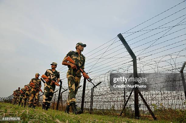 Indian Border Security Force soldiers patrolling at the near Petrapole Border outpost at the India-Bangladesh Border on the outskirts of...