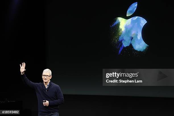 Apple CEO Tim Cook waves after a product launch event on October 27, 2016 in Cupertino, California. Apple Inc. Unveiled the latest iterations of its...