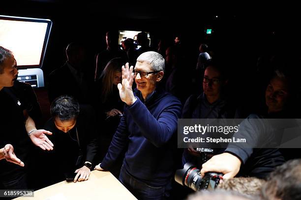 Apple CEO Tim Cook waves during a product launch event on October 27, 2016 in Cupertino, California. Apple Inc. Unveiled the latest iterations of its...