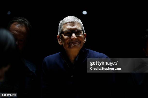 Apple CEO Tim Cook smiles during a product launch event on October 27, 2016 in Cupertino, California. Apple Inc. Unveiled the latest iterations of...