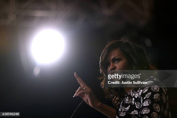 First Lady Michelle Obama speaks during a campaign rally with democratic presidential nominee former Secretary of State Hillary Clinton at Wake...