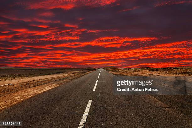 road in the desert at sunset - driving car australia road copy space sunlight travel destinations colour image day getting stock pictures, royalty-free photos & images
