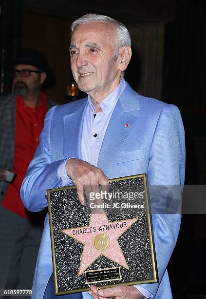 Charles Aznavour receives a Honorary Walk Of Fame Plaque by Senator Kevin De Leon at the Pantages Theatre on October 27, 2016 in Hollywood,...