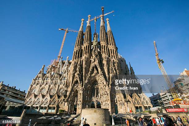 low angle view of sagrada familia cathedral - barcelona sagrada familia stock-fotos und bilder