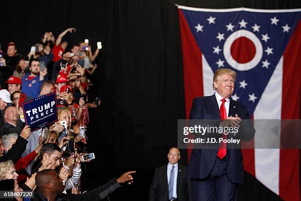 Republican presidential nominee Donald Trump walks on stage during a campaign event at the SeaGate Convention Centre on October 27, 2016 in Toledo,...