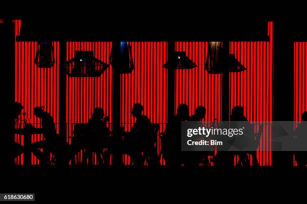 people in red cafe at night - nightclub outside stock pictures, royalty-free photos & images