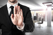 businessman in modern office hand stop gesture