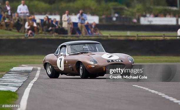 Jaguar E-type owned by Paul Webb and driven by Jackie Oliver & John Young in the RAC TT Celebration race at Goodwood on September 9, 2016 in...