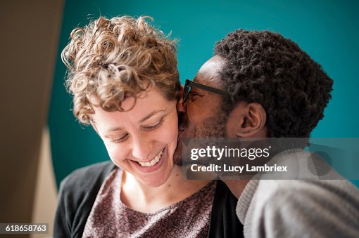 Man kissing his girlfriend Man kissing his girlfriend